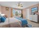 Bright bedroom with large windows, a ceiling fan, and stylish decor at 1449 Danielle Dr, Indianapolis, IN 46231
