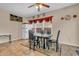 Dining area featuring neutral walls, table with four chairs, tile floor, and large window at 1449 Danielle Dr, Indianapolis, IN 46231