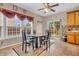 Charming eat-in kitchen area with a dining table set, complemented by tile flooring and natural light at 1449 Danielle Dr, Indianapolis, IN 46231