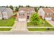 Beautiful two-story home with a well-manicured lawn, mature trees, and attached two-car garage at 1449 Danielle Dr, Indianapolis, IN 46231