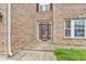 Close-up of a brick home featuring a decorative front door and a well-maintained walkway at 1449 Danielle Dr, Indianapolis, IN 46231