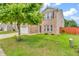 Two-story brick and vinyl home with a manicured lawn, mature tree, and an attached two-car garage at 1449 Danielle Dr, Indianapolis, IN 46231