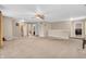 Spacious living room with carpet floors, neutral walls and multiple entry ways at 1449 Danielle Dr, Indianapolis, IN 46231