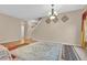 Bright living area with neutral walls, multiple rugs, and two entryways leading into other rooms at 1449 Danielle Dr, Indianapolis, IN 46231