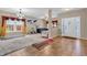 Inviting living room featuring tiled floors, neutral walls, and ample natural light with multiple furnishings at 1449 Danielle Dr, Indianapolis, IN 46231