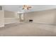 Large carpeted living room with neutral walls and ceiling fan at 1449 Danielle Dr, Indianapolis, IN 46231
