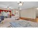 Cozy room with carpeted floors, featuring a bed, chandelier, and natural light from the window at 1449 Danielle Dr, Indianapolis, IN 46231