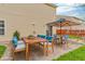 Inviting outdoor patio featuring a dining set and additional seating, perfect for entertaining guests at 1449 Danielle Dr, Indianapolis, IN 46231