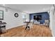 Comfortable basement area with vinyl flooring, a cozy seating area, and ample natural light at 1481 Wrenwood Dr, Columbus, IN 47201