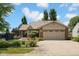 Charming single-story home featuring a well-maintained lawn, brick accents, and an attached two-car garage at 1481 Wrenwood Dr, Columbus, IN 47201