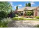 Landscaped front yard with a black aluminum fence featuring a walkway to the entry door at 1481 Wrenwood Dr, Columbus, IN 47201