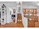 Hallway with hardwood flooring and a stairway to the upper floors at 1481 Wrenwood Dr, Columbus, IN 47201