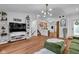 Open-concept living space with hardwood floors, stylish shelving, and abundant natural light at 1481 Wrenwood Dr, Columbus, IN 47201