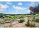 Beautiful backyard pond with water lilies, rock edging, and diverse plants, creating a serene outdoor retreat at 1481 Wrenwood Dr, Columbus, IN 47201
