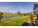 Landscaped backyard with pond view and manicured lawn at 15600 Woodford Dr, Westfield, IN 46074