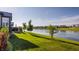 Lush backyard with a view of the serene lake in a Gathering-friendly neighborhood at 15600 Woodford Dr, Westfield, IN 46074