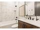 Well-lit bathroom with a marble tile shower, a stylish vanity, and modern fixtures at 15600 Woodford Dr, Westfield, IN 46074