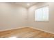 Bright bedroom features hardwood floors and a window providing natural light at 15600 Woodford Dr, Westfield, IN 46074