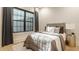 Comfortable bedroom with a large window, plush bedding, and stylish decor elements at 15600 Woodford Dr, Westfield, IN 46074