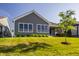 Well-maintained exterior shows covered patio and manicured lawn at 15600 Woodford Dr, Westfield, IN 46074