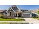 Charming two-story home featuring a gray exterior, manicured lawn, and welcoming front porch at 15600 Woodford Dr, Westfield, IN 46074