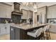 Modern kitchen featuring gray cabinets, a large island, and stylish backsplash at 15600 Woodford Dr, Westfield, IN 46074
