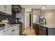 Contemporary kitchen with stainless steel appliances, gray cabinetry and herringbone backsplash at 15600 Woodford Dr, Westfield, IN 46074