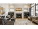 Cozy living room with a fireplace, built-in bookshelves, and neutral decor at 15600 Woodford Dr, Westfield, IN 46074
