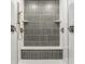 Close-up of a modern shower featuring vertical tile, dual shower heads and controls, and glass enclosure at 15600 Woodford Dr, Westfield, IN 46074