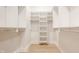 Spacious walk-in closet with built-in shelving and hanging rods, providing ample storage space at 15600 Woodford Dr, Westfield, IN 46074
