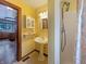 Bathroom featuring a pedestal sink, tiled floor, and a shower stall at 1602 California St, Columbus, IN 47201