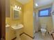 Bathroom featuring a pedestal sink, tiled floor, and good lighting at 1602 California St, Columbus, IN 47201