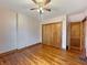 Bedroom with hardwood floors, closet with wooden doors, and traditional design at 1602 California St, Columbus, IN 47201