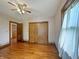 Bedroom with hardwood floors, closet with wooden doors, and traditional design at 1602 California St, Columbus, IN 47201