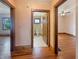 Hallway with hardwood floors leads to a bathroom and bedroom showcasing the home's layout at 1602 California St, Columbus, IN 47201