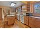 Well-lit kitchen with hardwood floors, ample cabinets, and modern appliances at 1602 California St, Columbus, IN 47201