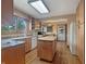 Bright kitchen with wooden cabinets, an island, and modern appliances at 1602 California St, Columbus, IN 47201