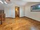 Spacious living room with hardwood floors leading to a bathroom at 1602 California St, Columbus, IN 47201