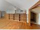 Living room with hardwood floors and custom built-in shelving at 1602 California St, Columbus, IN 47201