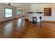 Hardwood floors highlight an open living room with a fireplace and natural light at 1602 California St, Columbus, IN 47201