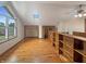 Bright living room featuring wood floors and custom built-in shelving at 1602 California St, Columbus, IN 47201
