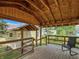 Relaxing covered porch overlooking the backyard at 1602 California St, Columbus, IN 47201