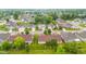 Spacious neighborhood with manicured lawns, mature trees, and diverse architectural styles, aerial view at 1605 Leisure Way, Greenfield, IN 46140
