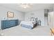 Neutral bedroom featuring blue dresser, ceiling fan and carpeted floors at 1605 Leisure Way, Greenfield, IN 46140