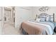 Comfortable bedroom featuring a bed with stylish linens, closet with sliding doors, and open doorway at 1605 Leisure Way, Greenfield, IN 46140