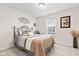 Comfortable bedroom featuring a bed with stylish linens, side table, and a window view at 1605 Leisure Way, Greenfield, IN 46140