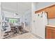 Bright dining area open to living area with neutral tones and ample seating at 1605 Leisure Way, Greenfield, IN 46140