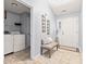 Entryway featuring tiled floor, a bench, and a laundry room with washer and dryer at 1605 Leisure Way, Greenfield, IN 46140