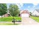 Beautiful brick home featuring a well-kept lawn and curb appeal at 1605 Leisure Way, Greenfield, IN 46140