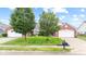 Charming brick home with well-manicured lawn and mature trees at 1605 Leisure Way, Greenfield, IN 46140